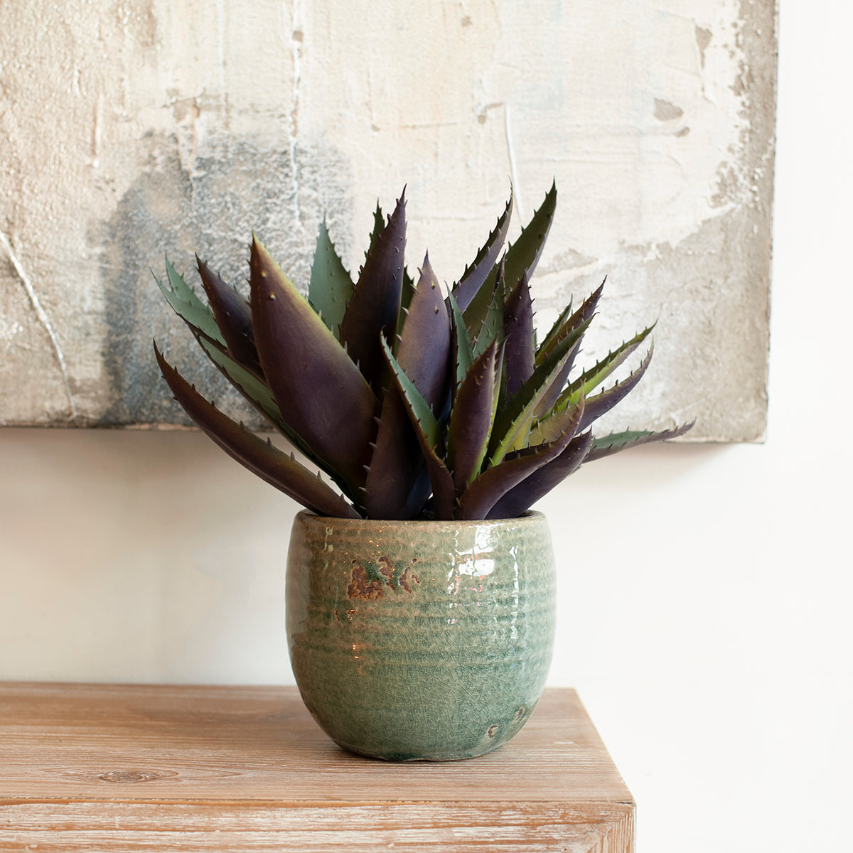 faux aloe in clay pot close up