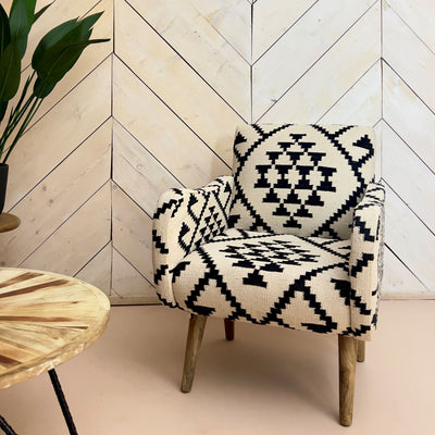 Kahina, Kilim armchair. Its chunky woven kilim, pattern in monochrome hues will add an eclectic element