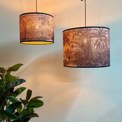 Two hanging lamps with decorative lampshades in a room setting.Mrs Robinson