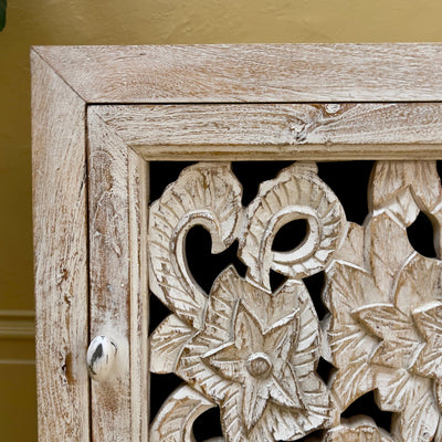 Carved bedside cabinet close