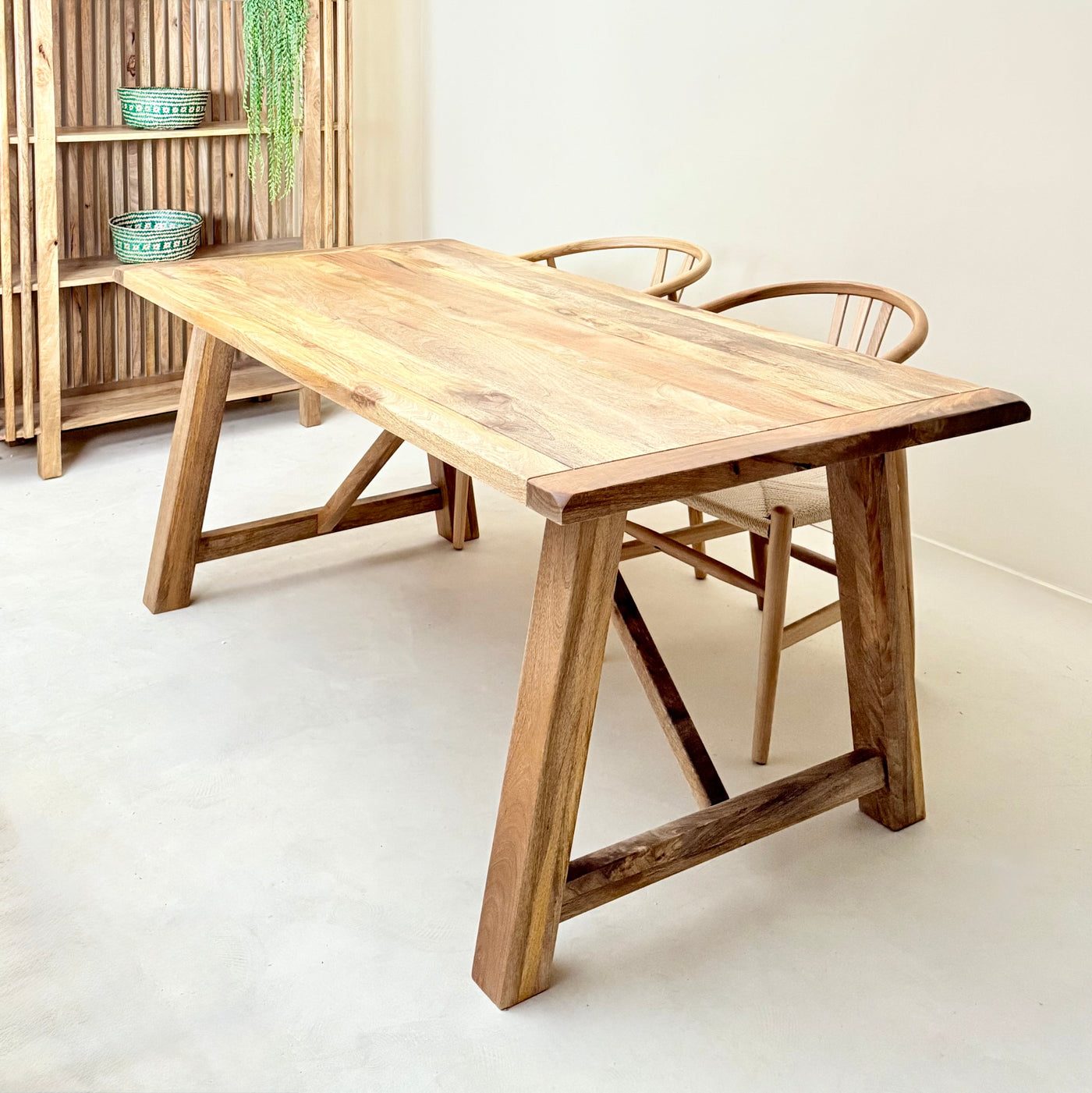 Wooden dining table with chairs in a minimalistic room