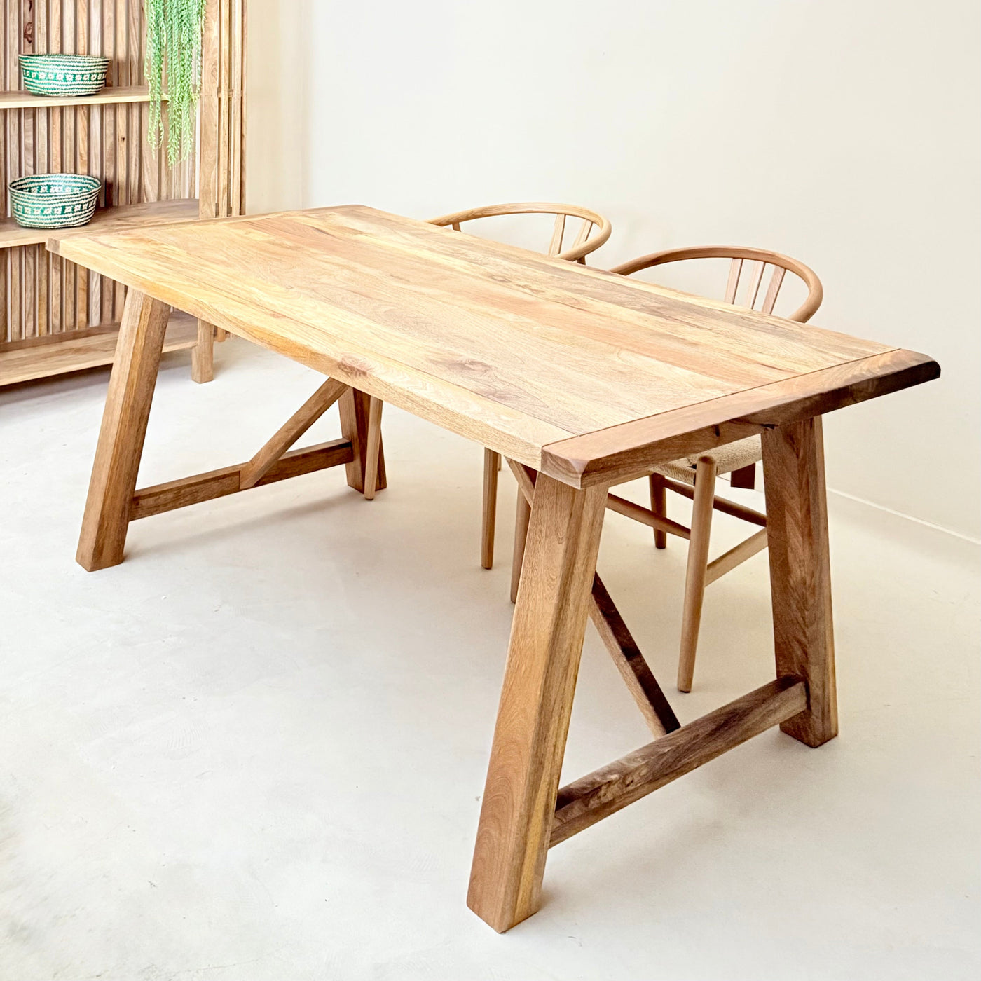 Wooden dining table with chairs in a minimalistic room