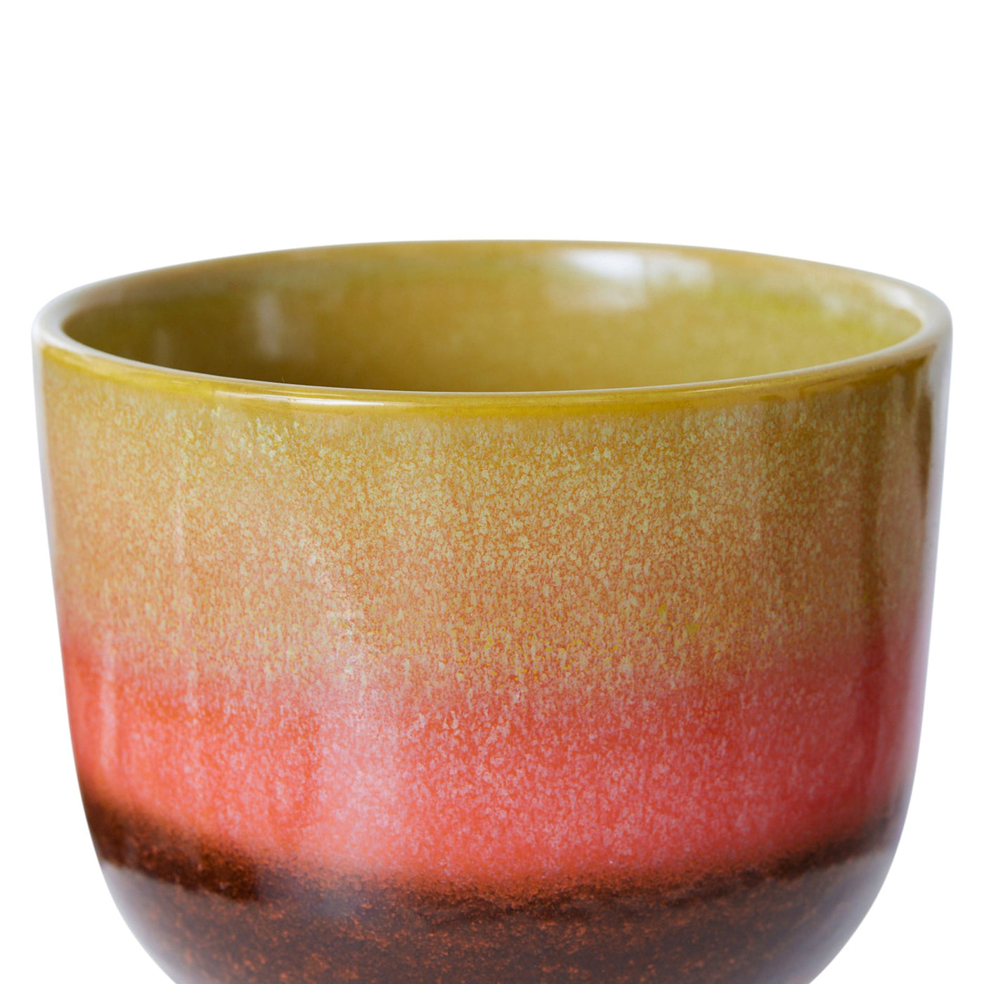 Ceramic mug with gradient color from yellow to red on a white background