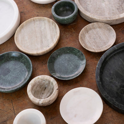 Collection of various ceramic bowls on a wooden surface