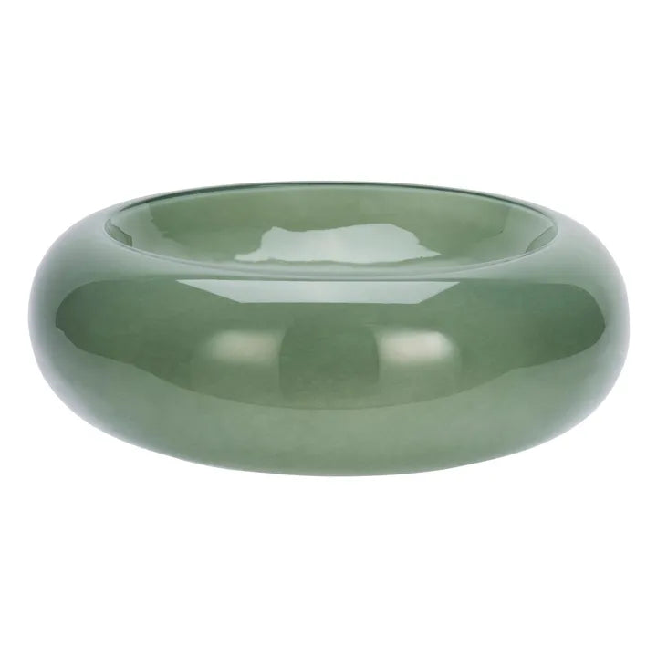 Green glass bowl on a white background