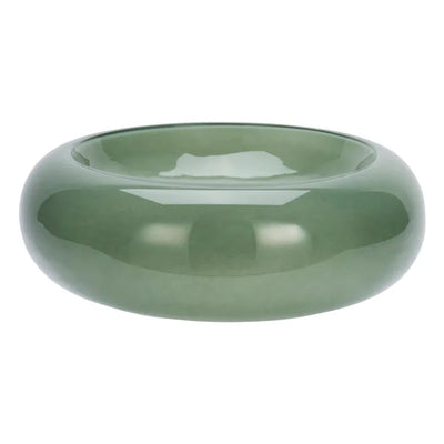 Green glass bowl on a white background