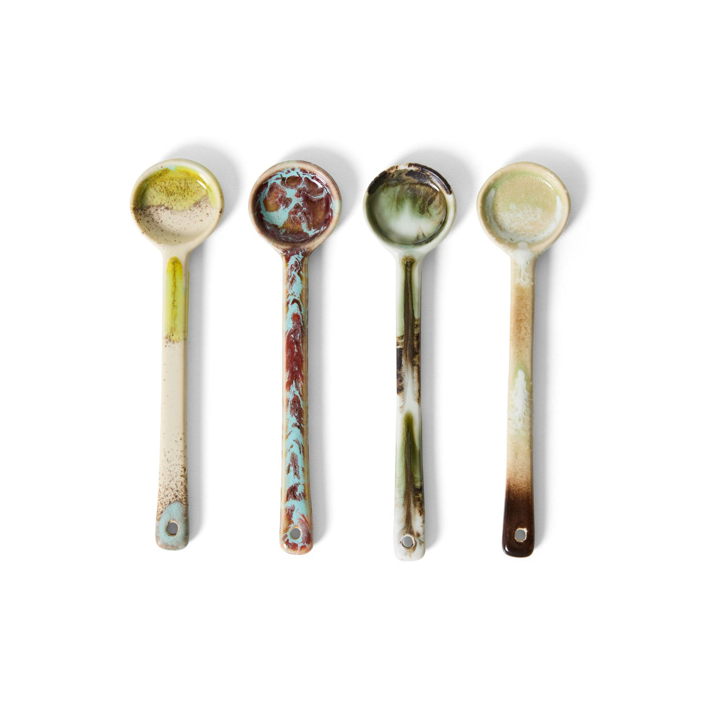 Four decorative spoons with marbled patterns on a white background
