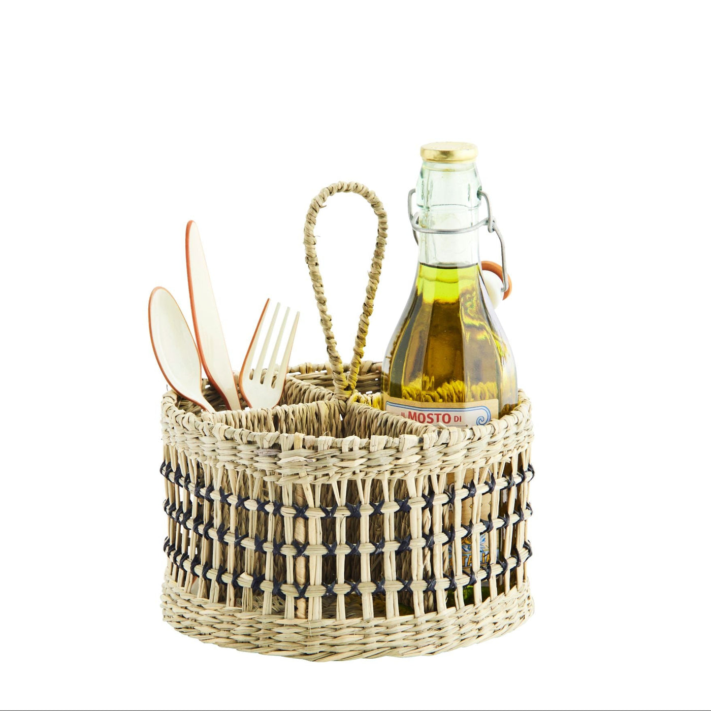 Woven basket with cutlery and a bottle of oil on a white background
