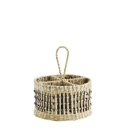 Woven basket with a handle on a white background