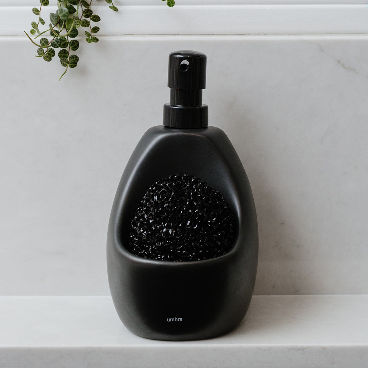 black ceramic soap dispenser with scrubber