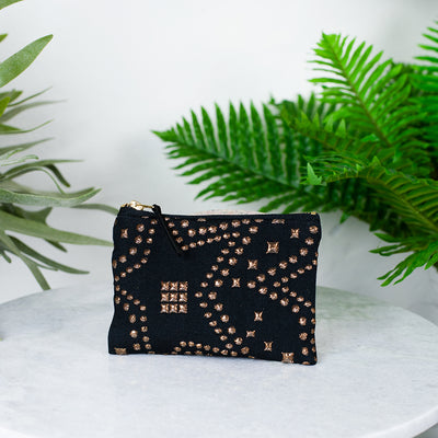 black star studded purse
